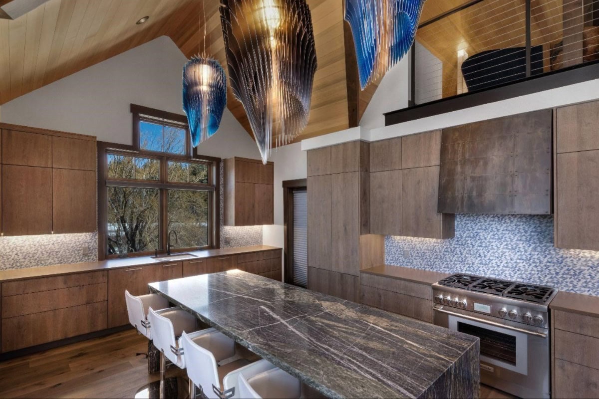 kitchen with stone countertops and crystal light fixtures