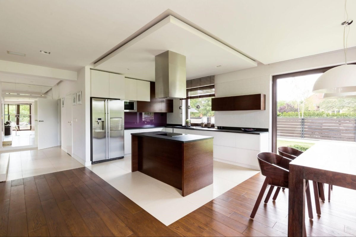 white and wood kitchen with lighting fixtures