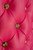 Gold buttons on the tufts.